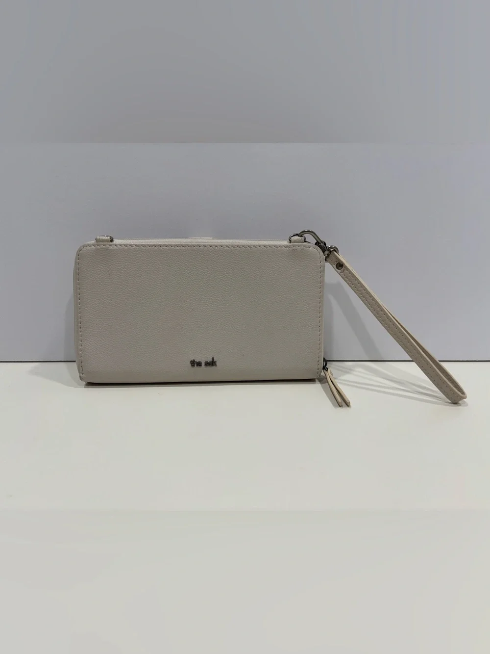 The Sak Light Cream Wristlet Clutch